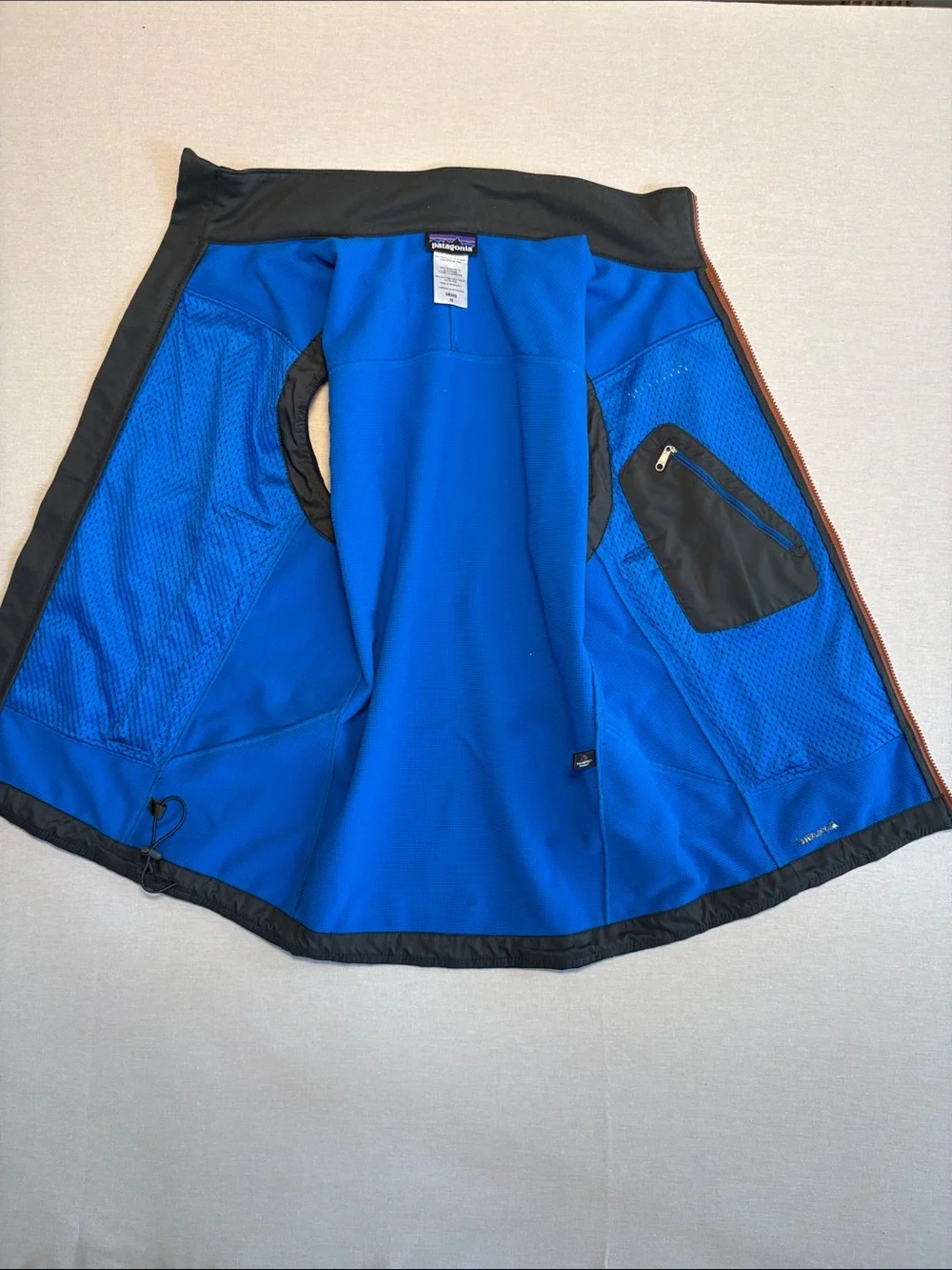 Patagonia Navy Blue Softshell Vest with Orange Accents